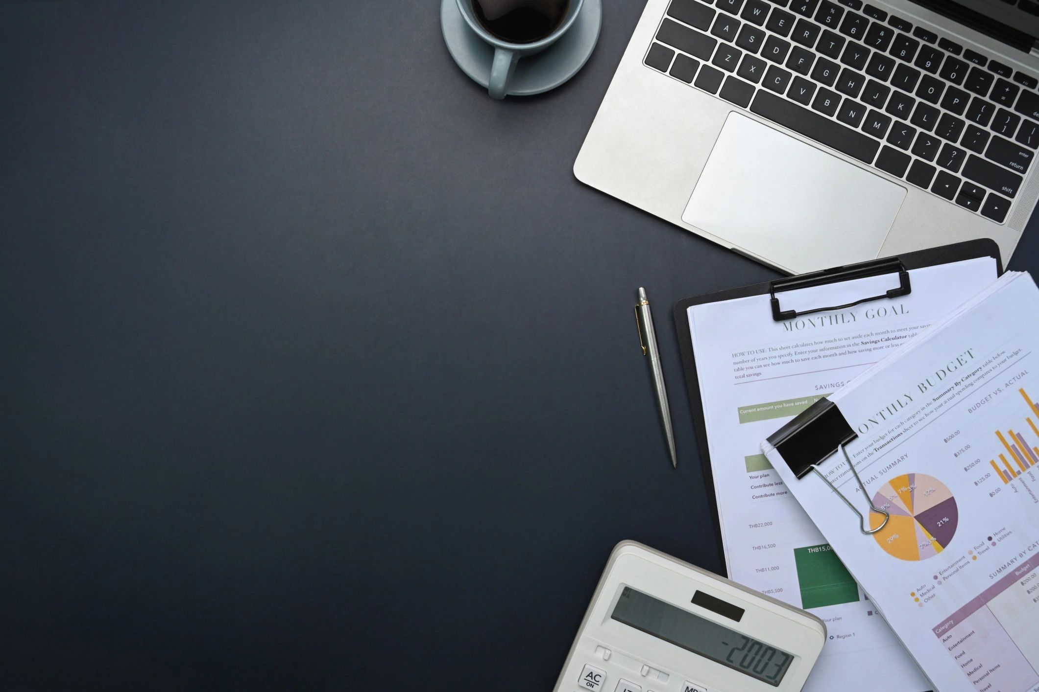Desk with calculator and financial documents