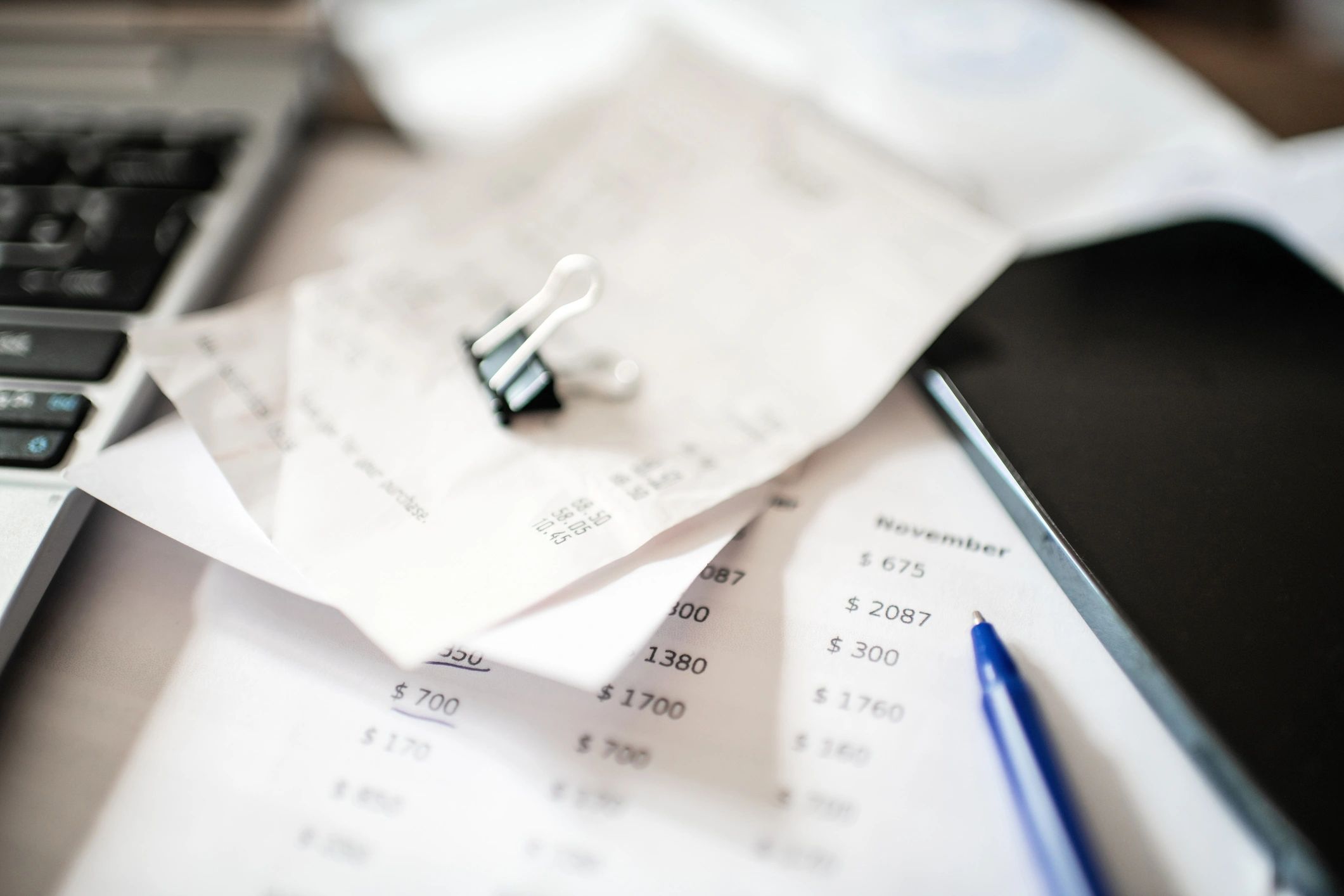 Tax documents and calculator on a desk