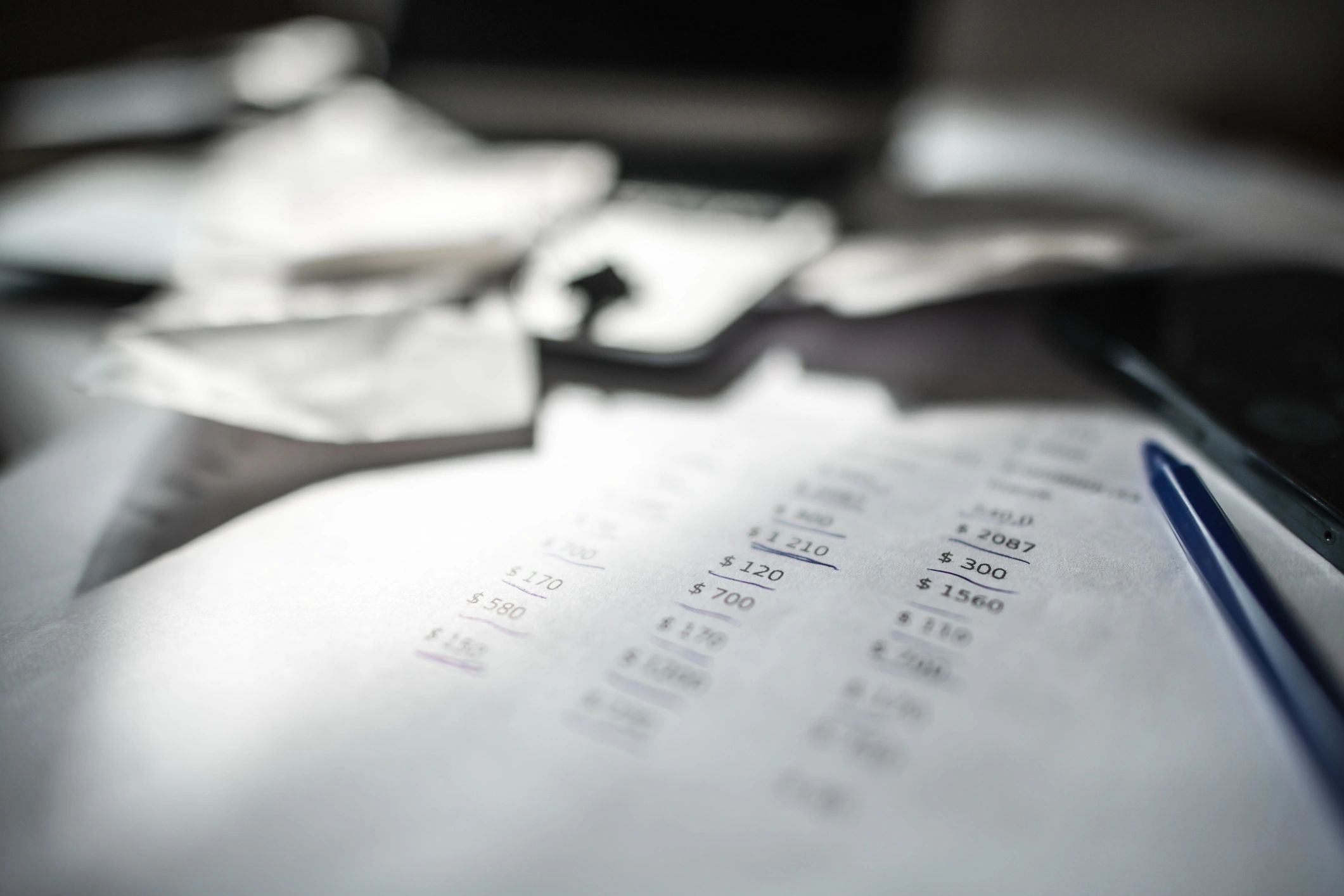 Tax planning documents with calculator and notebook on a desk